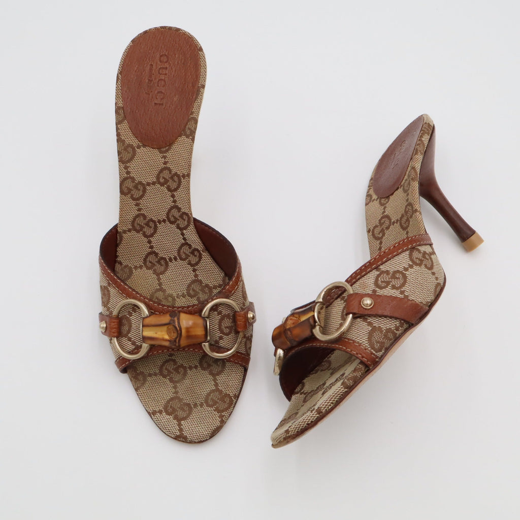 Vintage Gucci GG Canvas Bamboo Horsebit Mules — flat lay