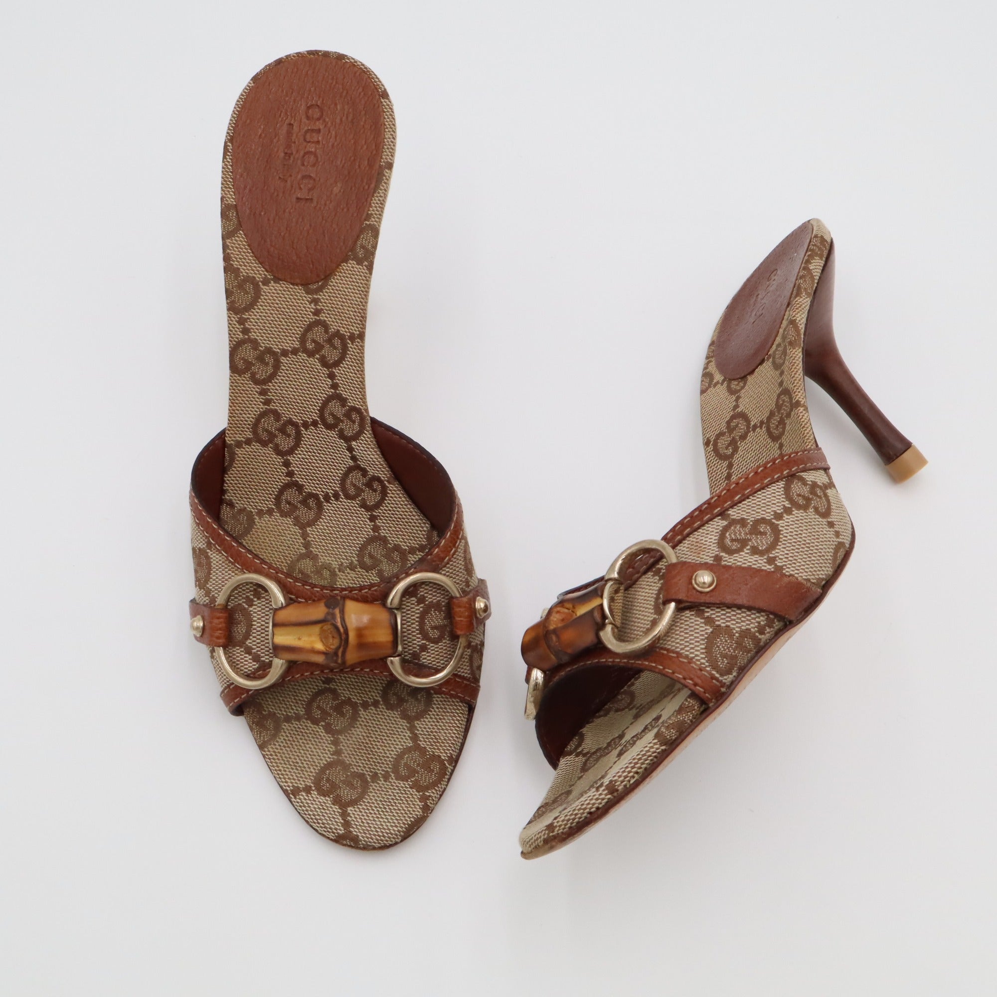 Vintage Gucci GG Canvas Bamboo Horsebit Mules — flat lay